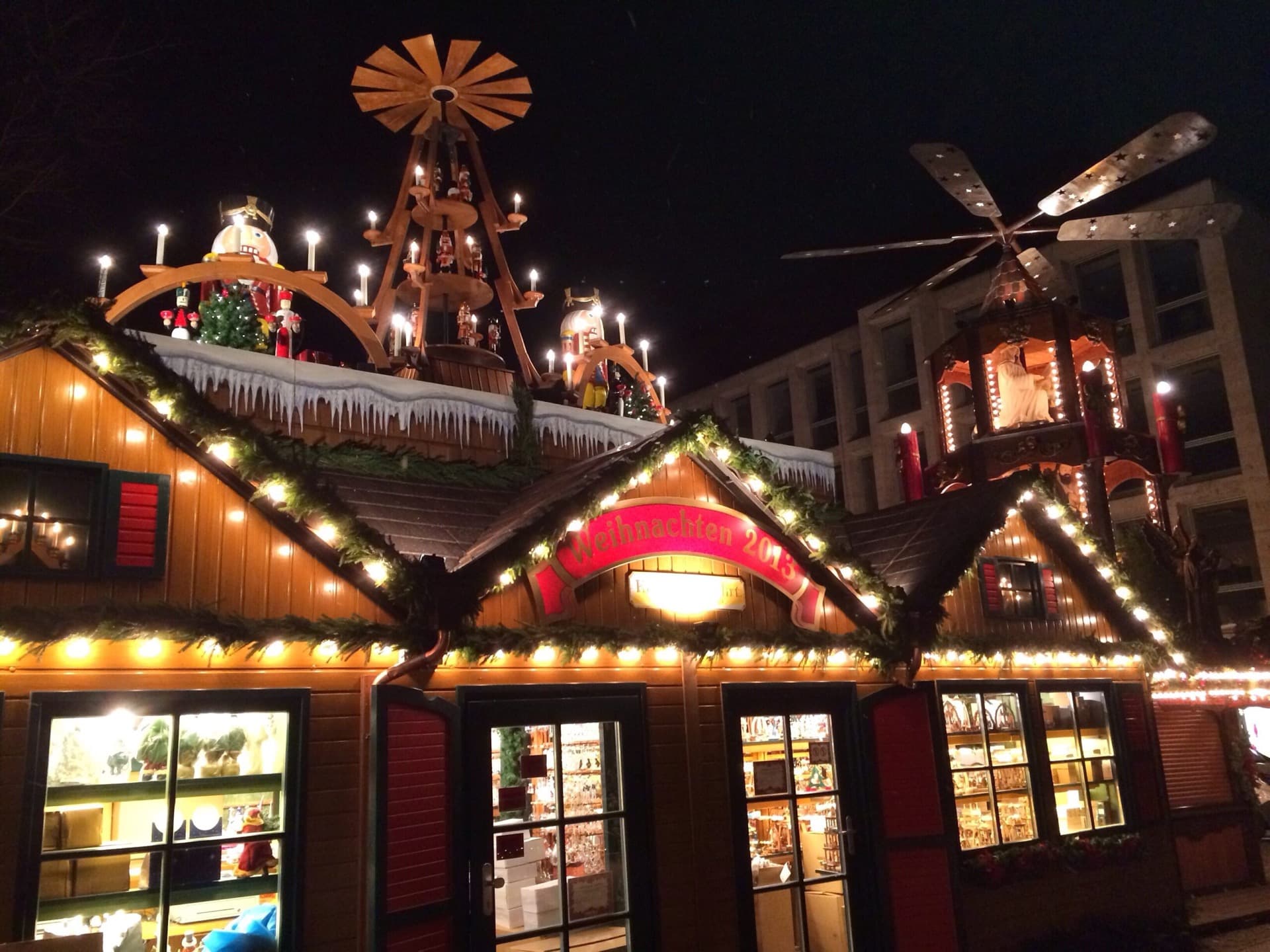 Christmas market storefront with professional holiday lighting