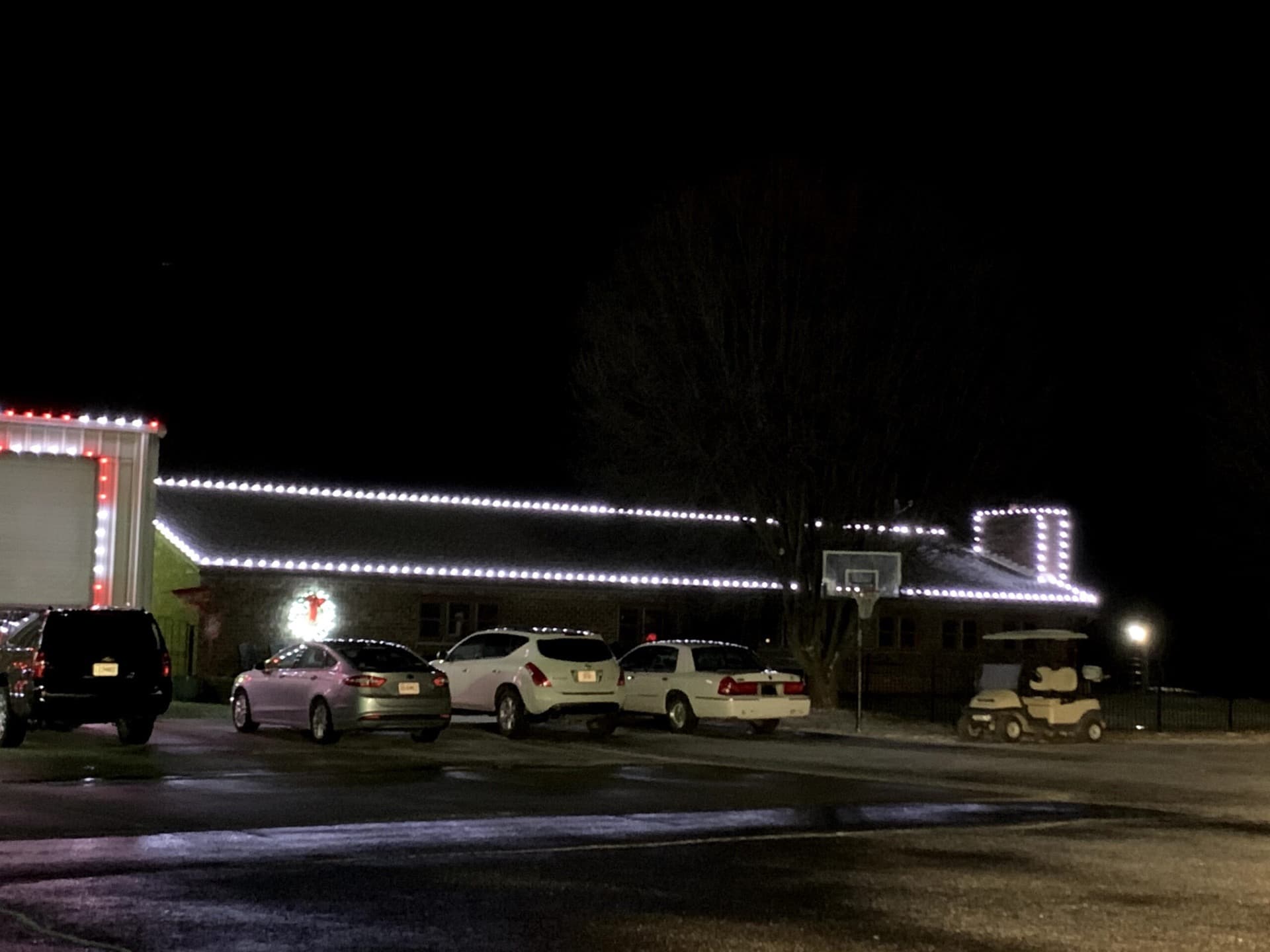 Clubhouse with warm white roofline lights for commercial holiday installation